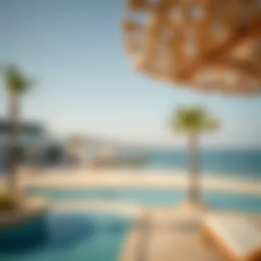 Scenic beach view at Al Hamra Village highlighting relaxation spots