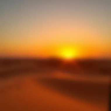 A scenic view of desert dunes during sunset